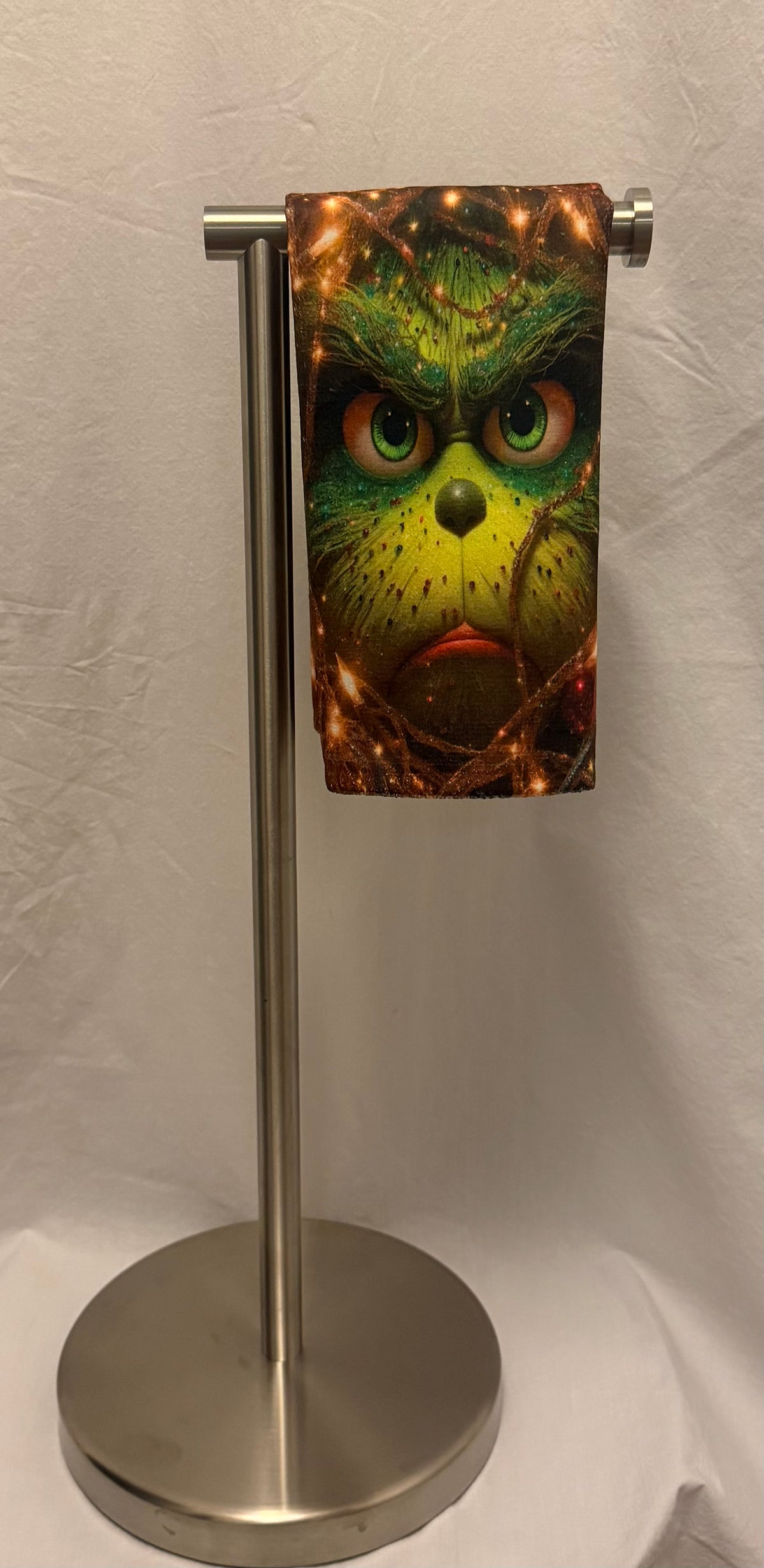 Christmas Green face peeking Through lights hand towel