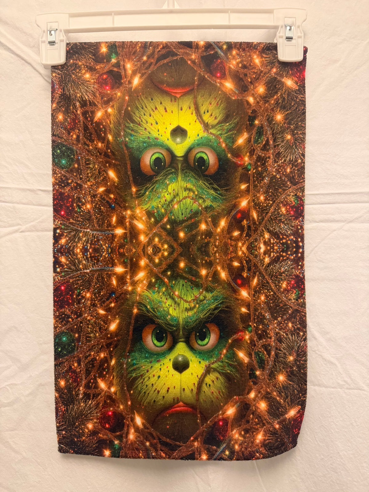 Christmas Green face peeking Through lights hand towel