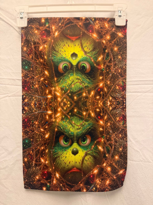 Christmas Green face peeking Through lights hand towel
