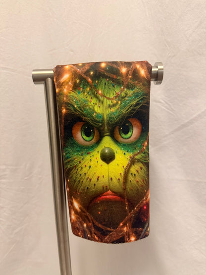 Christmas Green face peeking Through lights hand towel